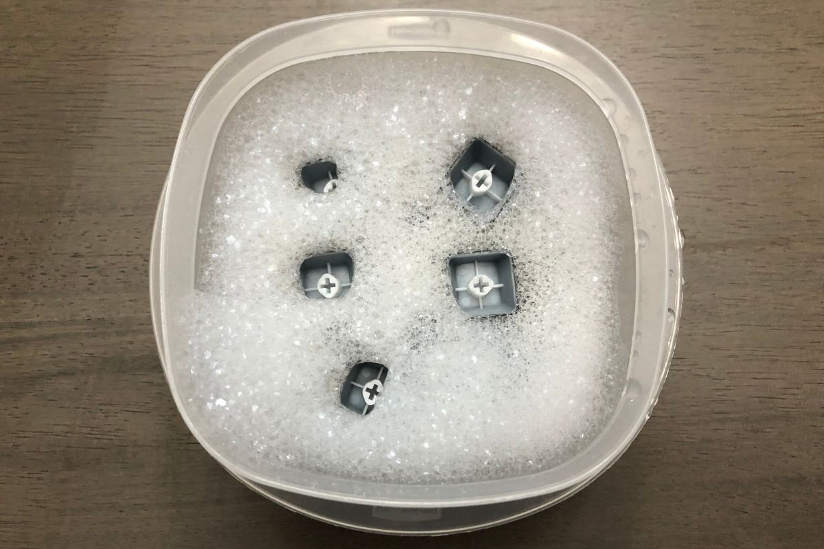 Soak keycaps in warm water