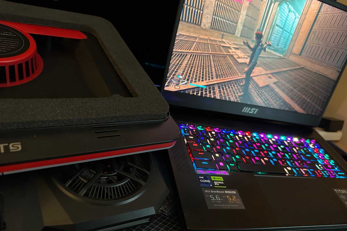 MSI laptop next to IETS laptop cooling pad