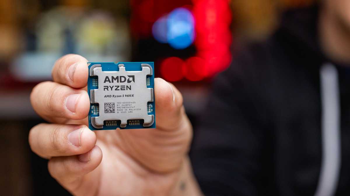 AMD Ryzen 5 9600X held in a hand (Ryzen 9000 launch)